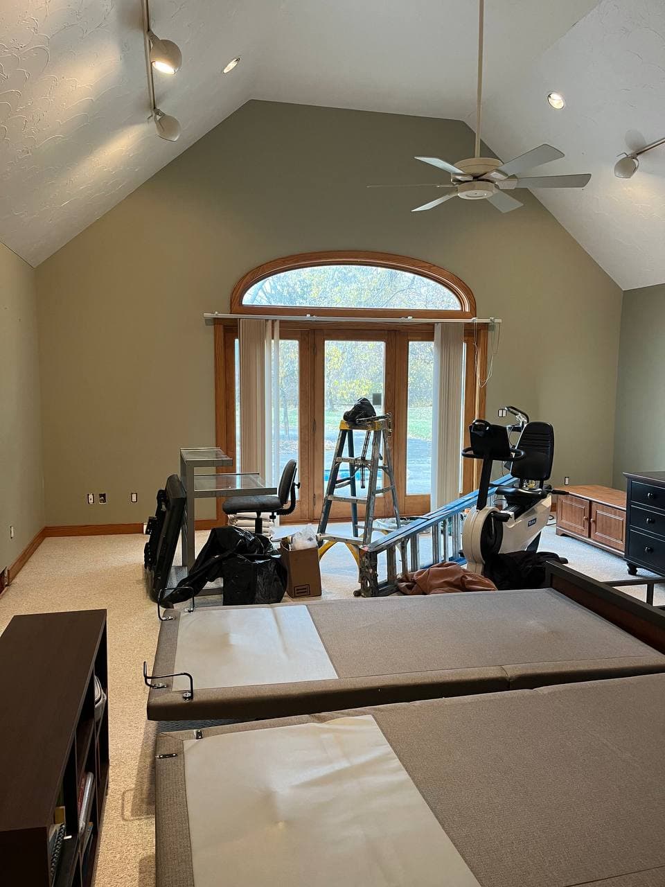 Bedroom after repainting, sage green walls