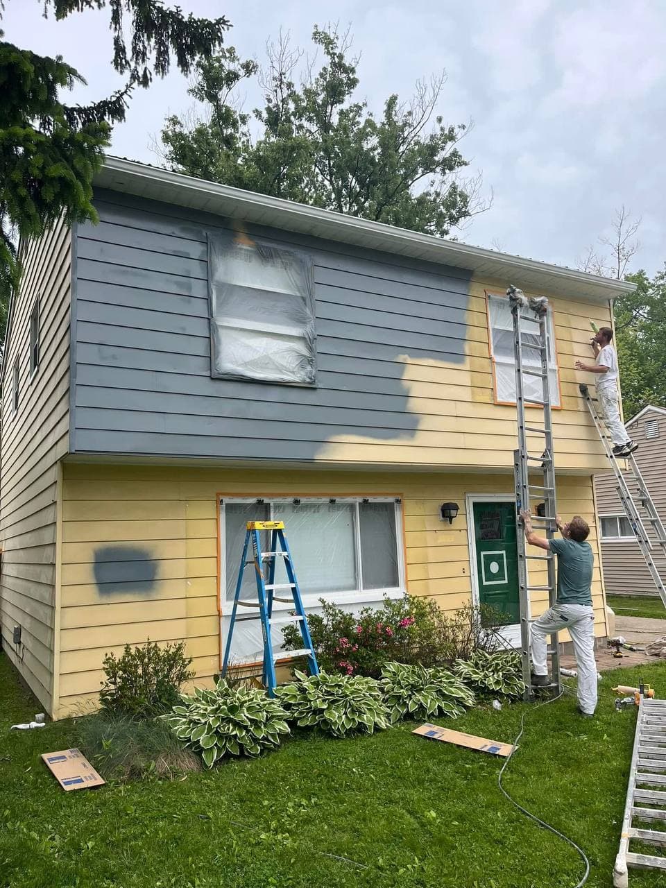 House exterior before repainting, yellow siding