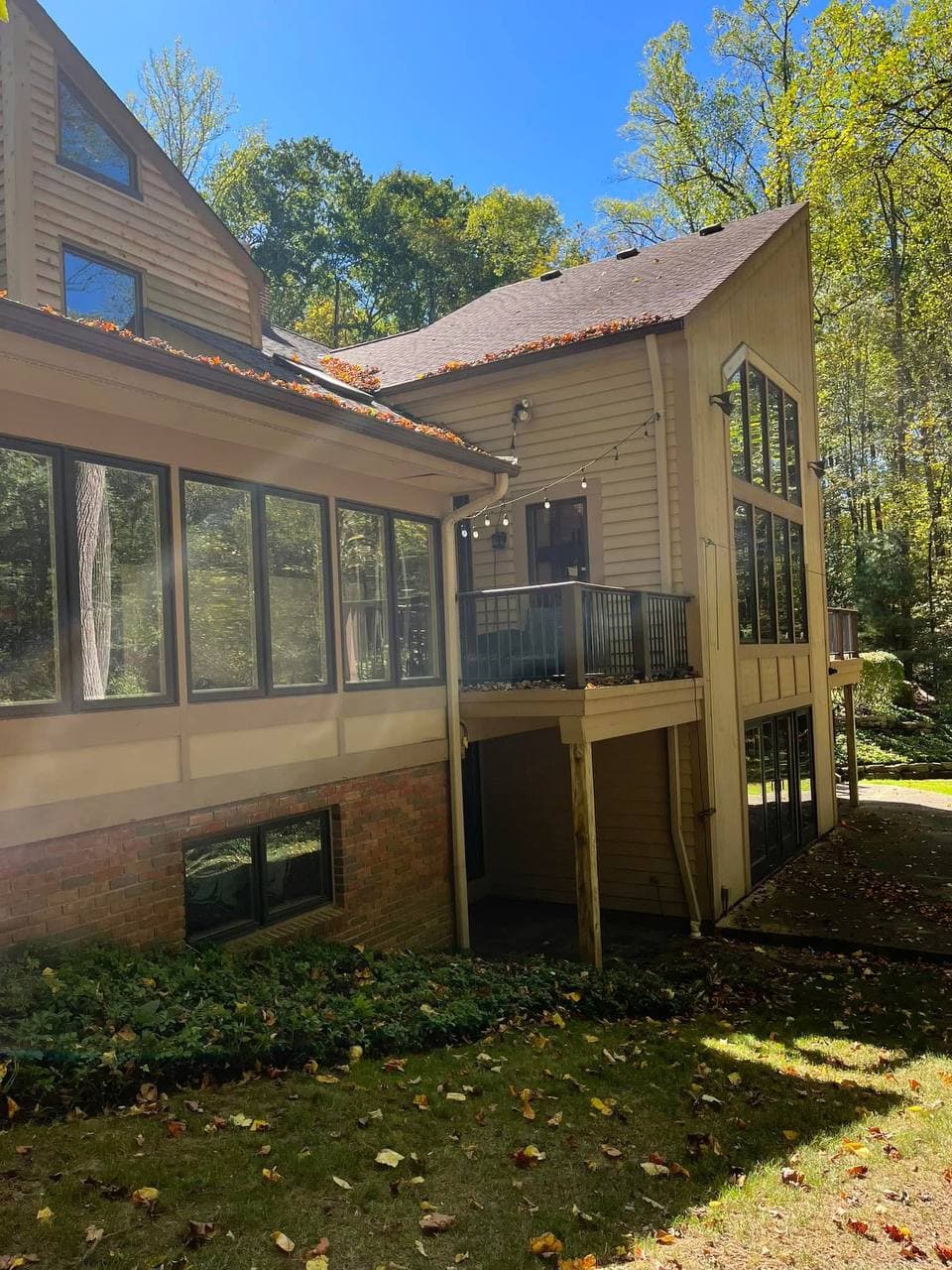 House exterior before repainting, tan siding
